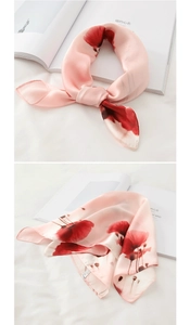 Detailed view of pink silk scarf with red poppy floral print and rolled edge 53x53cm