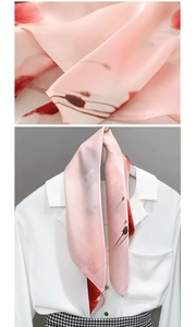 Detail of pink tie-dye silk scarf showing smooth texture and floral pattern on white shirt