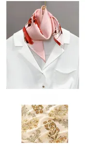 Detail view of floral tie-dye silk scarves with daisy and lycoris patterns on a shirt