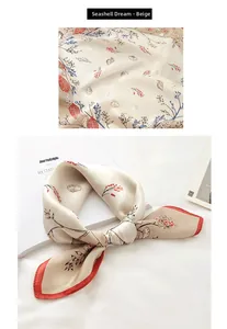 Detailed close-up of beige silk scarf featuring seashell prints and dark red hem edges