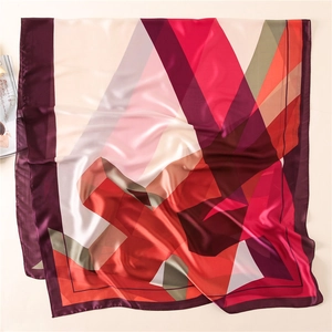 Detailed view of square silk scarf with modern abstract geometric patterns in deep purple