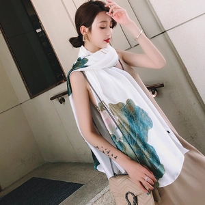 Detail of silk-like scarf with lotus prints showing natural drape on a model