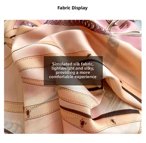 Detailed close-up of chain print silk scarf fabric with pink and beige equestrian patterns