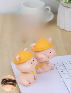 Close-up of cute pink pig shaking head ornament with durable spring design feature