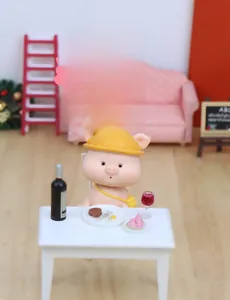 Cute nodding pig doll set with miniature dining table and chairs in a micro-landscape setup