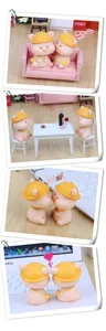 Detailed shots of cute pink nodding pig figurines in various desktop lifestyle settings