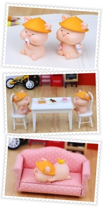 Vue détaillée de figurines miniatures de cochons en résine pour décor de bureau mignon