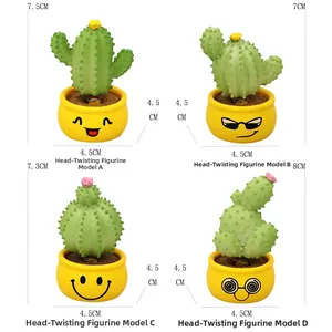 Detailed size view of four cartoon cactus car bobbleheads with spring bases