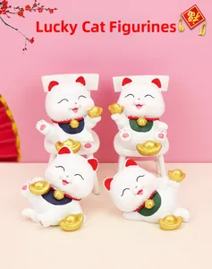Detailed view of four colorful Lucky Cat resin figurines in sitting and lying poses