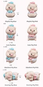 Detail view showing eight cute piglet figurines in pink and blue pastel resin colors
