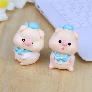 Cute sailor pig resin figurines set for desk and car decor in a cozy office setting