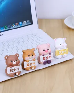 Set of four cute resin animal figurines including a bear and cat with inspirational signs