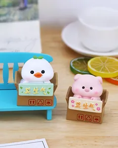 Miniature duck and pig desktop ornaments in cardboard box base with de-stress theme