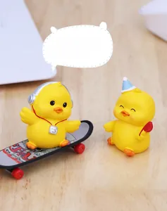 Miniature resin yellow ducks featuring headphones, skateboard and blue party hat details