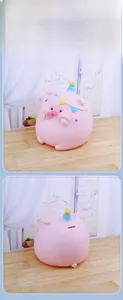 Front and back detail of a pink cartoon pig piggy bank with a blue striped party hat