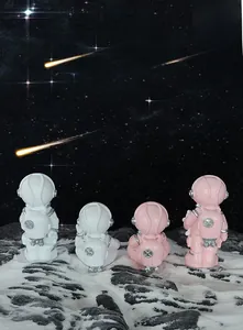 Set of four creative astronaut figurines in pink and white for car or home desk decoration
