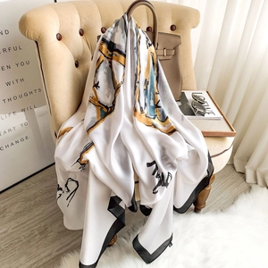 Elegant white satin scarf with abstract yellow and blue print and black borders