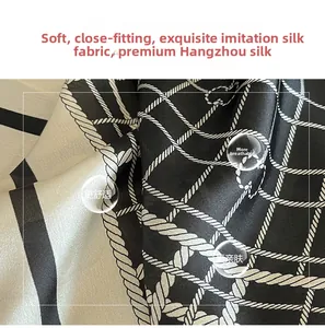 Close-up of soft plaid silk scarf fabric with nautical rope pattern and breathable texture
