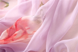 Macro detail of lavender chiffon fabric with abstract floral prints and soft texture