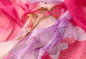 Detail of lightweight floral chiffon scarf with elegant pink and purple prints