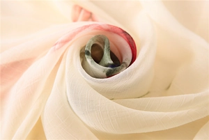 Macro detail of breathable silk scarf fabric with elegant abstract ink floral printing