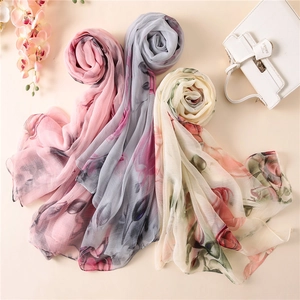 Elegant floral print lightweight scarf for women in pink, blue, and cream pastel colors