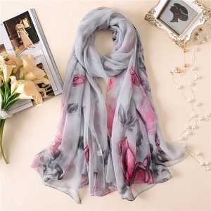 Detailed view of floral pattern on semi-transparent lightweight chiffon scarf for women