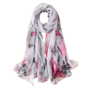 Elegant women's long chiffon scarf featuring large pink rose floral print on light grey background