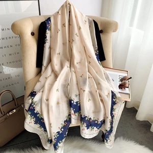 Floral faux silk scarf with strawberry print and blue border for spring and summer