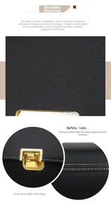Detail of black lychee grain texture bag with gold hardware and contrast stitching