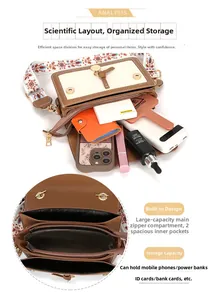 Detail view of the brown shoulder bag with embroidered strap and interior compartments