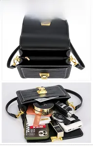Internal view of black crocodile pattern square bag showing storage compartments and pockets