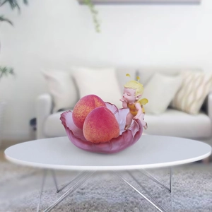 Purple flower petal tray with fairy figurine and decorative peaches for home decor