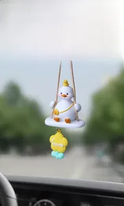 Detail of creative cartoon duck swinging car pendant with Happy Duck flower charm detail