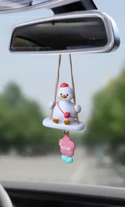 Cute white duck car mirror pendant with strawberry hat on a swing for interior decoration