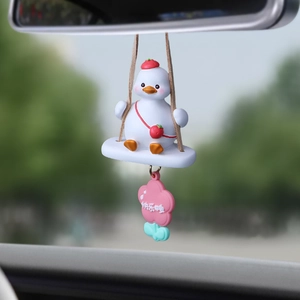 Cute white cartoon duck rearview mirror car charm with red hat on a swing