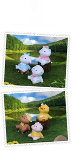 Close-up of cute resin animal figurines including cats and sheep for car or desk decor