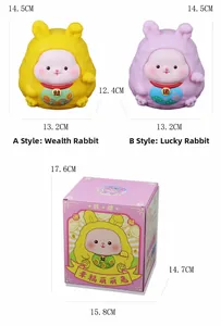 Detail view of rabbit money boxes with dimensions and festive gift box packaging