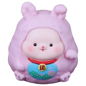 Pink Chinese zodiac rabbit piggy bank with lucky gold charm and floral bib on white background