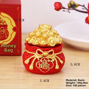 Detailed view of lucky money bag resin ornament showing 6.3cm height and 5.8cm width