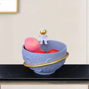 Astronaut snack bowl with blue lunar texture and gold Saturn ring for home decor