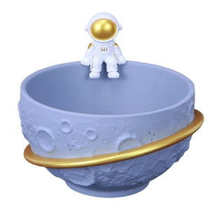 Creative astronaut lunar bowl ornament with crater texture and gold planetary ring
