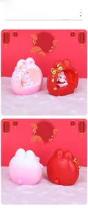 Detail of pink and red rabbit night lights with a hollow sphere design and bow charm