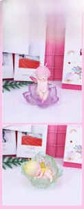 Detail of cartoon flower fairy night light featuring sleeping elves in floral resin bases