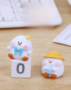 Cute cartoon bird resin figures for desk decor, featuring blue bow and yellow hat designs