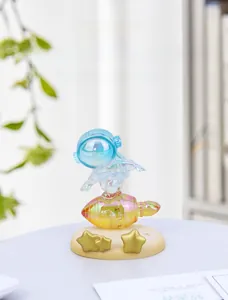 Iridescent resin astronaut on rocket figurine as a creative desk tablet stand