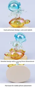 Macro detail of electroplated astronaut phone stand with colorful metallic finish