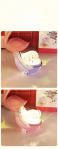 Detail of cute pig-shaped cradle night light with lace trim in pink and purple colors