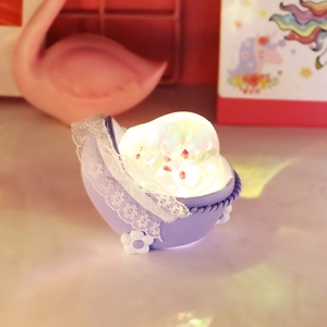 Cute purple cradle night light for bedroom bedside providing warm soft glow for sleeping