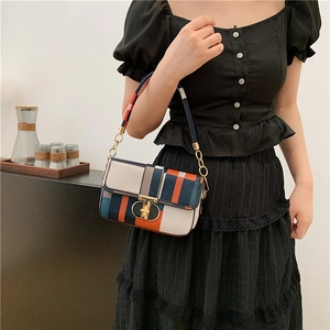 Retro contrast plaid crossbody bag with navy and orange pattern and gold metal lock